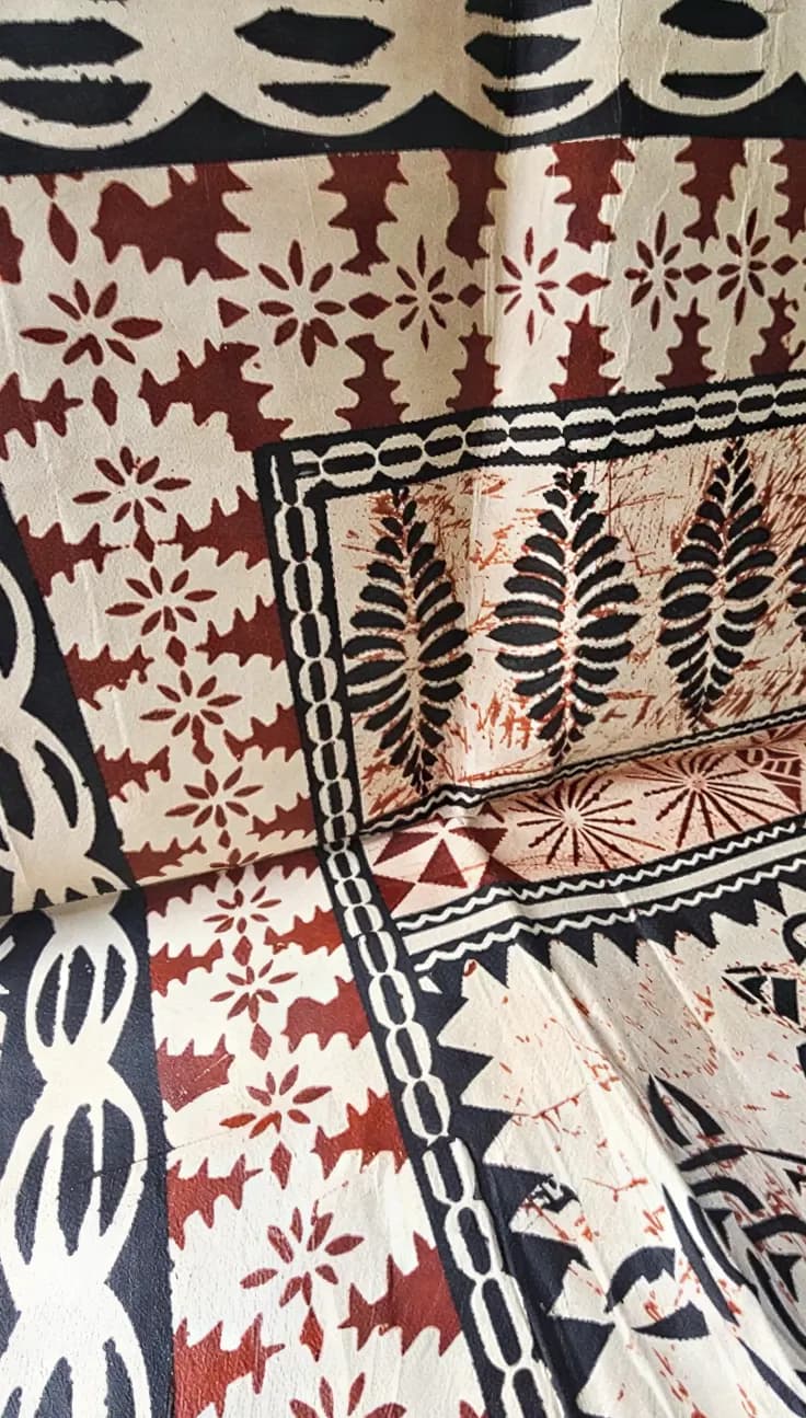 A tapa cloth printed with leaf and flower designs