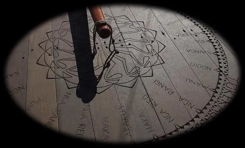 A star compass inscribed on a wooden deck